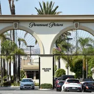 Billionaires Brawl Over Warner Bros.