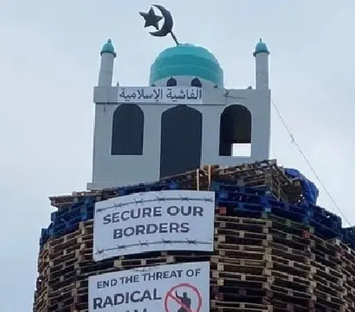 Man charged in connection with loyalist bonfire set ablaze with replica mosque on top