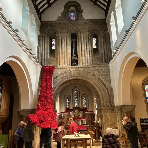 The Cascade of knitted  poppies launched at St Peter's service
