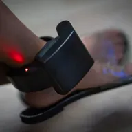 Why more immigrants are being tracked with ankle monitors – and who profits
