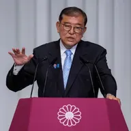 Japanese PM vows to stay on after ruling coalition loses upper house control