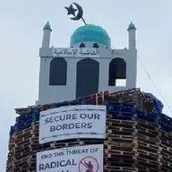 Man charged in connection with loyalist bonfire set ablaze with replica mosque on top