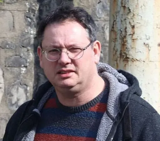 UCD professor charged with harassment and unlawfully accessing  students data