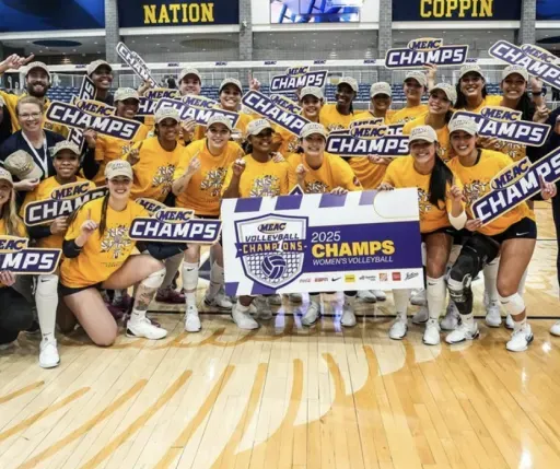 Coppin State volleyball head coach Tim Walsh updates Nestor on his MEAC champions